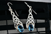 Load image into Gallery viewer, Sterling Silver Oval Blue Topaz Celtic Knot Dangle Hook Earrings