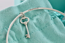Load image into Gallery viewer, Tiffany & Co. Silver Small Oval Key Dangle Bangle Bracelet *Custom*