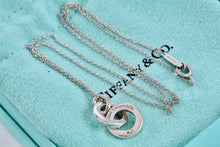 Load image into Gallery viewer, Tiffany &amp; Co. Small Silver Dangling Interlocking Circles Pendant Necklace
