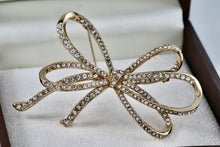 Load image into Gallery viewer, Anne Klein Gold Tone Rhinestone Ribbon Brooch
