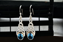 Load image into Gallery viewer, Sterling Silver Oval Blue Topaz Celtic Knot Dangle Hook Earrings
