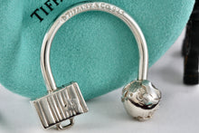 Load image into Gallery viewer, Tiffany &amp; Co. Silver World Globe &amp; Travel NYC USA Suitcase Horseshoe Keychain
