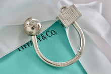 Load image into Gallery viewer, Tiffany &amp; Co. Silver World Globe &amp; Travel NYC USA Suitcase Horseshoe Keychain
