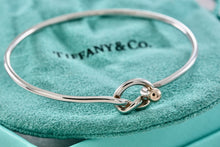 Load image into Gallery viewer, Tiffany &amp; Co. Vintage 14kt. Gold Trim &amp; Silver Love Knot Hook Bangle Bracelet
