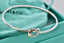 Load image into Gallery viewer, Tiffany &amp; Co. Vintage 14kt. Gold Trim &amp; Silver Love Knot Hook Bangle Bracelet
