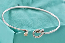 Load image into Gallery viewer, Tiffany &amp; Co. Vintage 14kt. Gold Trim &amp; Silver Love Knot Hook Bangle Bracelet
