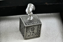 Load image into Gallery viewer, Hallmark Peanuts 5 Decades of Snoopy Cube Pewter Commemorative Figurine
