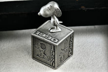 Load image into Gallery viewer, Hallmark Peanuts 5 Decades of Snoopy Cube Pewter Commemorative Figurine
