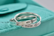 Load image into Gallery viewer, Tiffany &amp; Co. 1837 Silver Interlocking Narrow Band Rings Size 10
