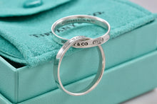 Load image into Gallery viewer, Tiffany &amp; Co. 1837 Silver Interlocking Narrow Band Rings Size 10
