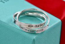 Load image into Gallery viewer, Tiffany &amp; Co. 1837 Silver Interlocking Narrow Band Rings Size 10
