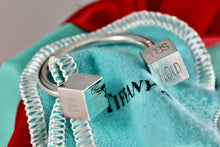 Load image into Gallery viewer, Tiffany &amp; Co. Silver BUY SELL HOLD Market Square Horseshoe Keychain Rare
