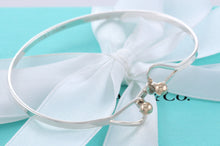 Load image into Gallery viewer, Tiffany &amp; Co. 14K Gold Trim &amp; Silver Double Heart Hook Bangle Bracelet
