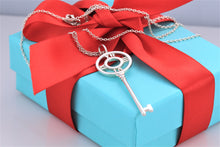 Load image into Gallery viewer, Tiffany &amp; Co. Atlas Silver Roman Numeral Key 2&quot; Pendant Necklace
