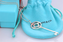 Load image into Gallery viewer, Tiffany &amp; Co. Atlas Silver Roman Numeral Key 2&quot; Pendant Necklace
