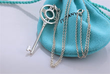 Load image into Gallery viewer, Tiffany &amp; Co. Atlas Silver Roman Numeral Key 2&quot; Pendant Necklace
