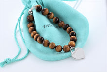 Load image into Gallery viewer, Return To Tiffany &amp; Co. Silver Tiger Eye Heart Charm 8mm Beaded Bracelet
