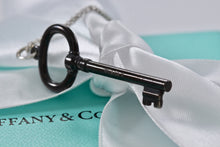 Load image into Gallery viewer, Tiffany &amp; Co. Silver &amp; Titanium Oval Key Pendant Necklace
