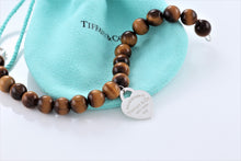 Load image into Gallery viewer, Return To Tiffany &amp; Co. Silver Tiger Eye Heart Charm 8mm Beaded Bracelet
