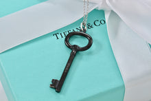 Load image into Gallery viewer, Tiffany &amp; Co. Silver &amp; Titanium Oval Key Pendant Necklace
