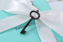 Load image into Gallery viewer, Tiffany &amp; Co. Silver &amp; Titanium Oval Key Pendant Necklace
