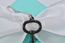 Load image into Gallery viewer, Tiffany &amp; Co. Silver &amp; Titanium Oval Key Pendant Necklace
