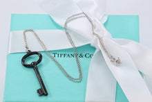 Load image into Gallery viewer, Tiffany &amp; Co. Silver &amp; Titanium Oval Key Pendant Necklace
