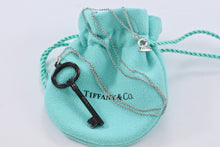 Load image into Gallery viewer, Tiffany &amp; Co. Silver &amp; Titanium Oval Key Pendant Necklace
