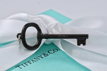 Load image into Gallery viewer, Tiffany &amp; Co. Silver Titanium Oval Key Pendant
