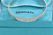Load image into Gallery viewer, Tiffany &amp; Co. Silver Yours &#39;&#39;Love Makes The World Go Round&#39;&#39; Beaded Edge Bangle Bracelet
