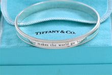 Load image into Gallery viewer, Tiffany &amp; Co. Silver Yours &#39;&#39;Love Makes The World Go Round&#39;&#39; Beaded Edge Bangle Bracelet
