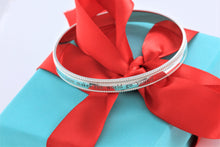 Load image into Gallery viewer, Tiffany &amp; Co. Silver Yours &#39;&#39;Love Makes The World Go Round&#39;&#39; Beaded Edge Bangle Bracelet
