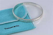 Load image into Gallery viewer, Tiffany &amp; Co. Silver Yours &#39;&#39;Love Makes The World Go Round&#39;&#39; Beaded Edge Bangle Bracelet
