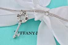 Load image into Gallery viewer, Tiffany &amp; Co. Atlas 18K White Gold 4 Diamond Circle Key Pendant Necklace

