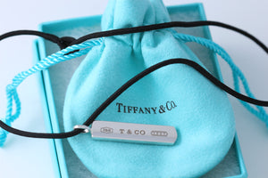 Tiffany & Co. 1837 18K White Gold Bar Pendant on 18'' Silk Cord