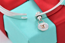 Load image into Gallery viewer, Tiffany &amp; Co. 18K Gold &amp; Silver Round Keyhole Lock Hinged Bangle Bracelet
