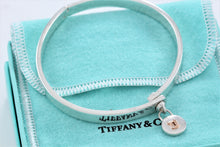 Load image into Gallery viewer, Tiffany &amp; Co. 18K Gold &amp; Silver Round Keyhole Lock Hinged Bangle Bracelet
