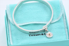 Load image into Gallery viewer, Tiffany &amp; Co. 18K Gold &amp; Silver Round Keyhole Lock Hinged Bangle Bracelet
