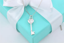 Load image into Gallery viewer, Tiffany &amp; Co. Silver Small Diamond Heart Key Pendant Necklace
