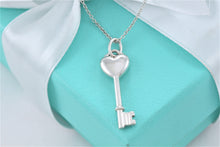 Load image into Gallery viewer, Tiffany &amp; Co. Silver Small Diamond Heart Key Pendant Necklace
