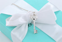 Load image into Gallery viewer, Tiffany &amp; Co. Silver Small Diamond Heart Key Pendant Necklace

