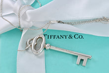 Load image into Gallery viewer, Tiffany &amp; Co. Silver Skeleton Oval Key Pendant Necklace
