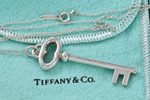 Load image into Gallery viewer, Tiffany &amp; Co. Silver Skeleton Oval Key Pendant Necklace
