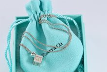 Load image into Gallery viewer, Tiffany &amp; Co. Atlas Silver Roman Numerals Square Cube Pendant Necklace
