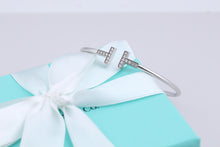 Load image into Gallery viewer, Tiffany &amp; Co. 18K White Gold Diamond T Wire Bangle Bracelet
