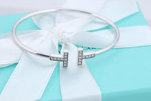 Load image into Gallery viewer, Tiffany &amp; Co. 18K White Gold Diamond T Wire Bangle Bracelet
