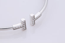 Load image into Gallery viewer, Tiffany &amp; Co. 18K White Gold Diamond T Wire Bangle Bracelet
