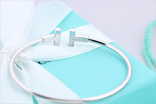 Load image into Gallery viewer, Tiffany &amp; Co. 18K White Gold Diamond T Wire Bangle Bracelet
