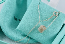 Load image into Gallery viewer, Tiffany &amp; Co. Mesh Silver Twist Knot Pendant Necklace
