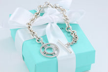 Load image into Gallery viewer, Tiffany &amp; Co. Silver Atlas Round Medallion Toggle Bracelet
